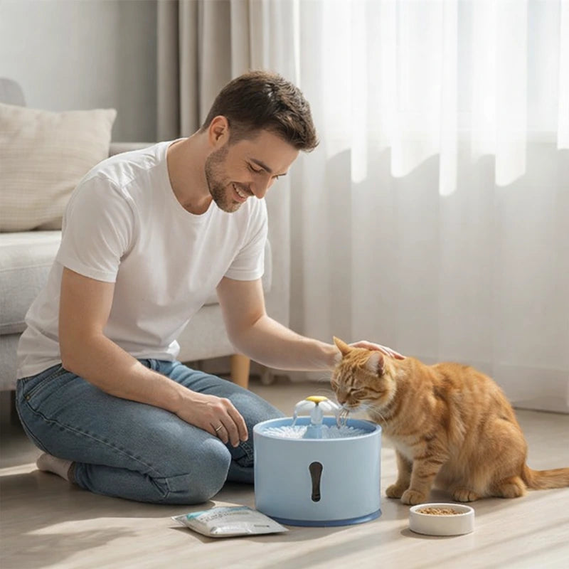 fontaine à eau chat bleue avec homme et chat